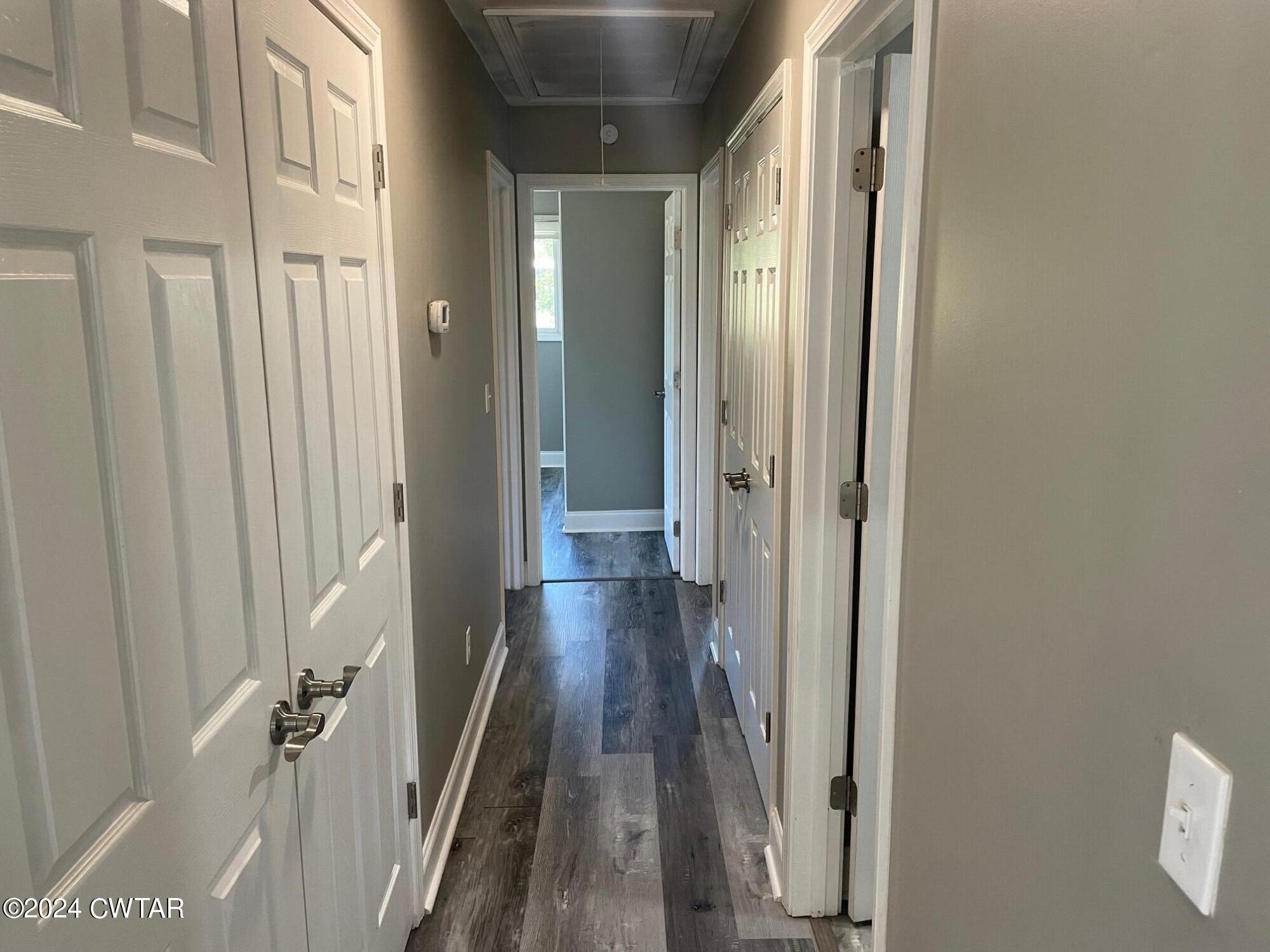 113 Ebenezer Road Mercer, TN 38392 - Photo 9 of 36 a view of a hallway with wooden floor and staircase
