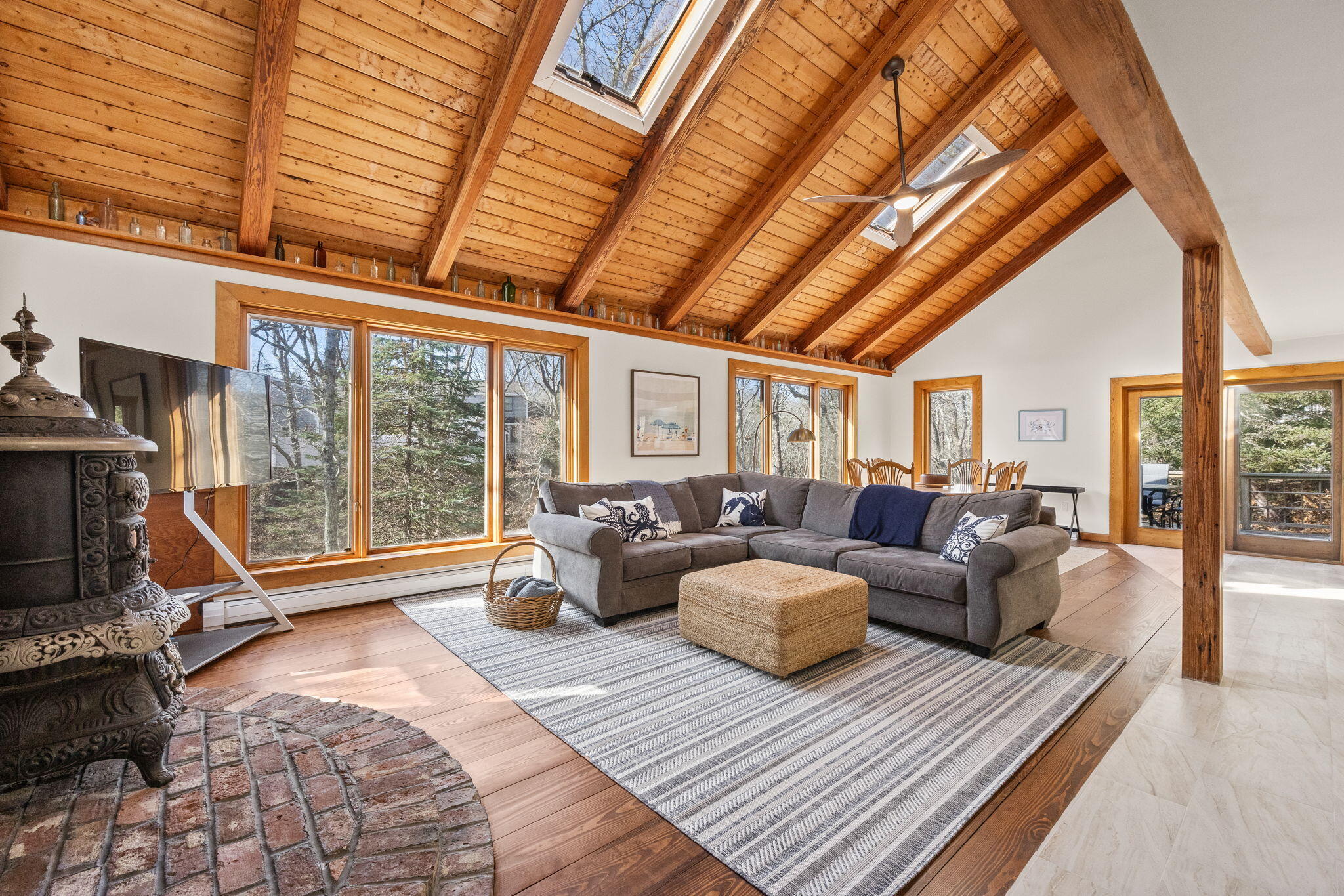 6 Deer Path Truro, MA 02666 - Photo 12 of 41 a living room with furniture and a floor to ceiling window
