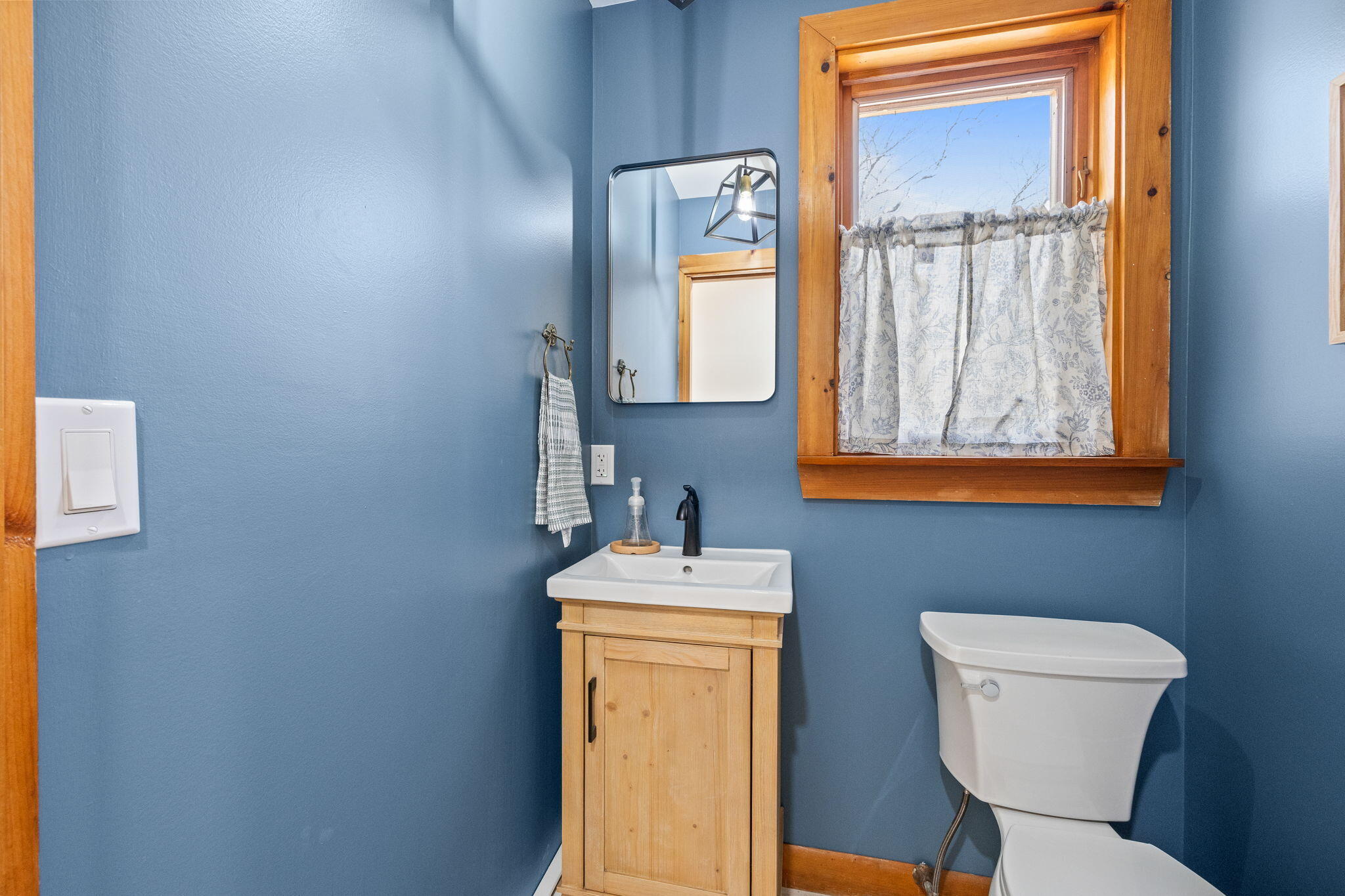 6 Deer Path Truro, MA 02666 - Photo 16 of 41 a bathroom with a toilet sink vanity and mirror