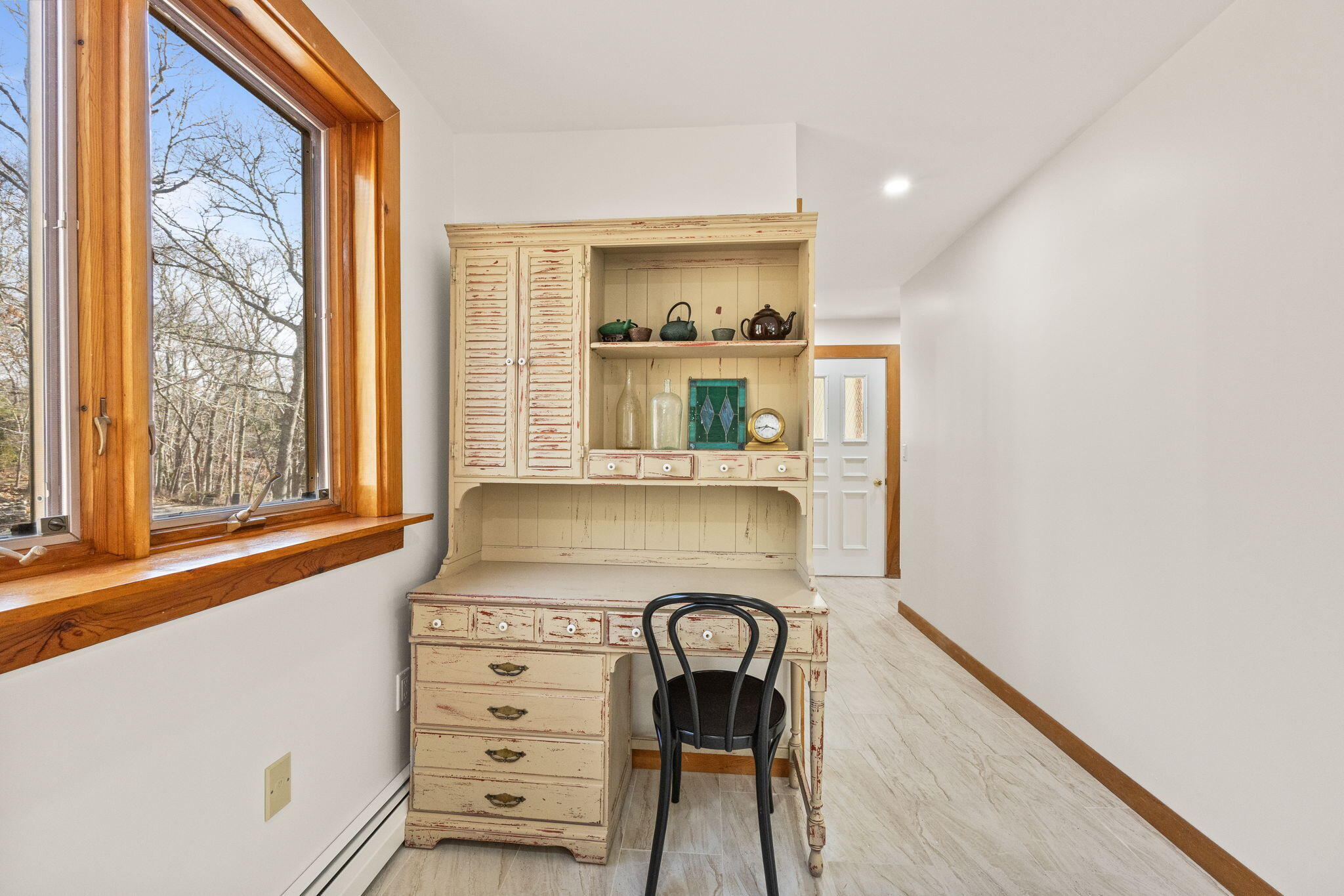 6 Deer Path Truro, MA 02666 - Photo 17 of 41 a view of a hallway with a dining table and chairs