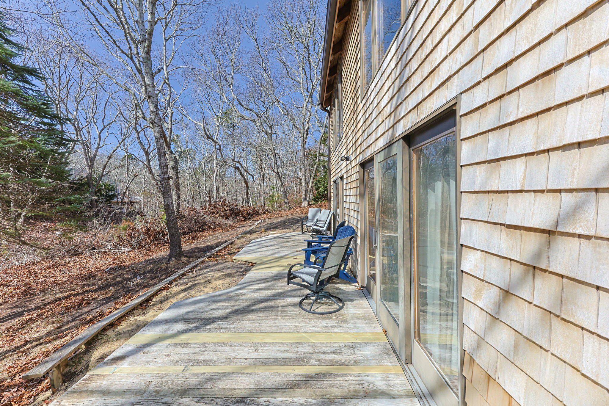 6 Deer Path Truro, MA 02666 - Photo 38 of 41 a view of yard with wooden door and chair