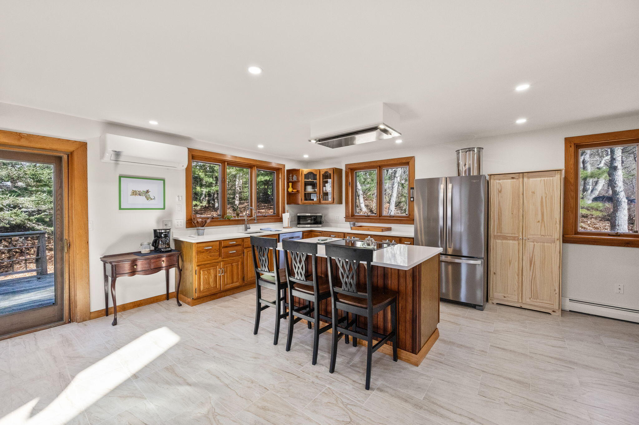 6 Deer Path Truro, MA 02666 - Photo 5 of 41 a dining room with a wooden table and chairs