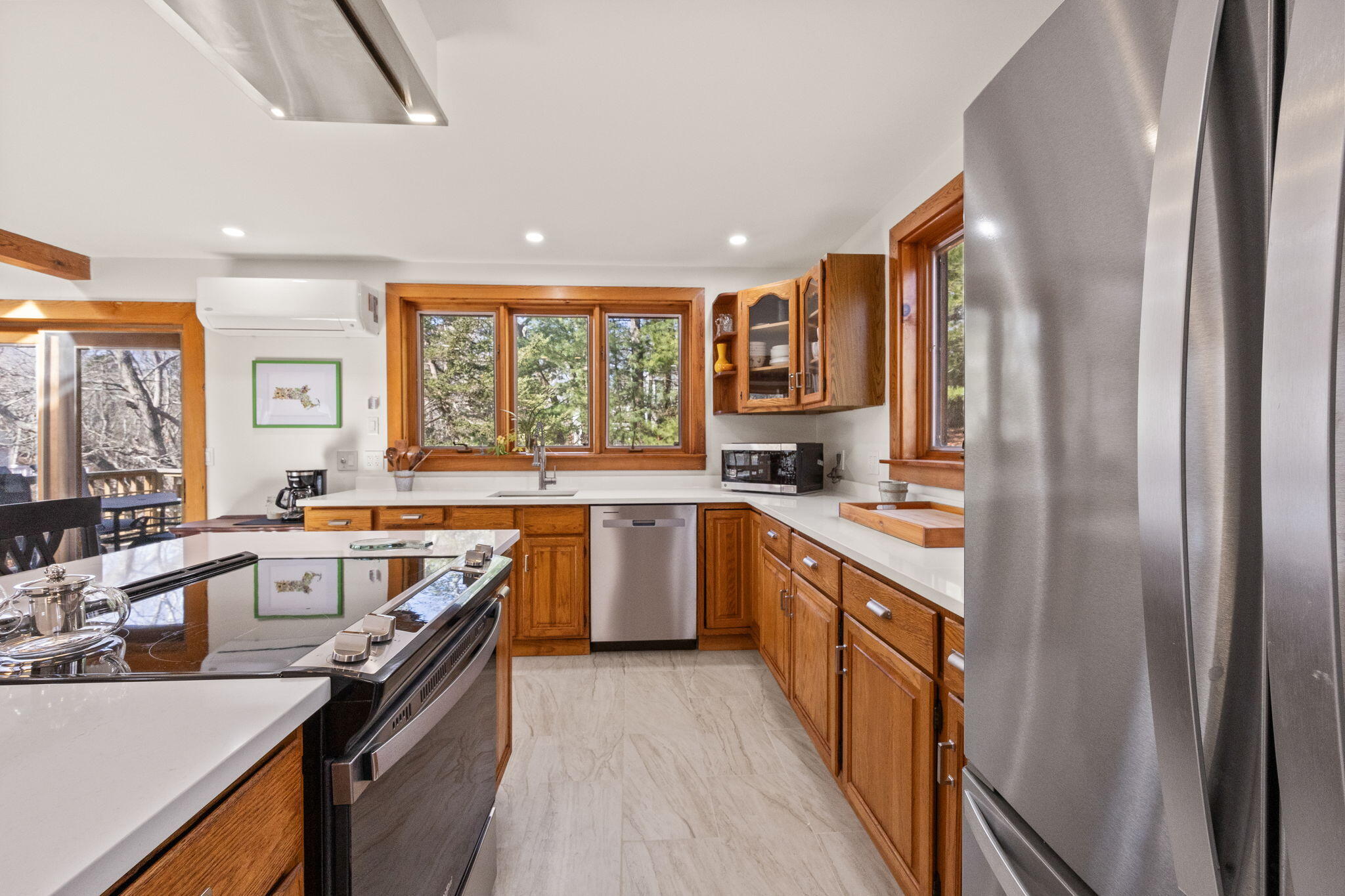 6 Deer Path Truro, MA 02666 - Photo 7 of 41 a large kitchen with a large window and stainless steel appliances