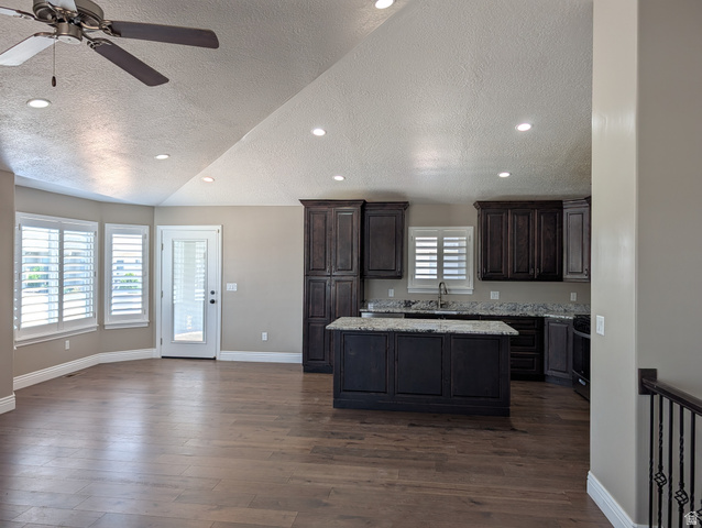 171 South Mustang Road East Grantsville, UT 84029 - Photo 5 of 41 Spacious area featuring wood-finish flooring, vaulted ceilings, and recessed lighting