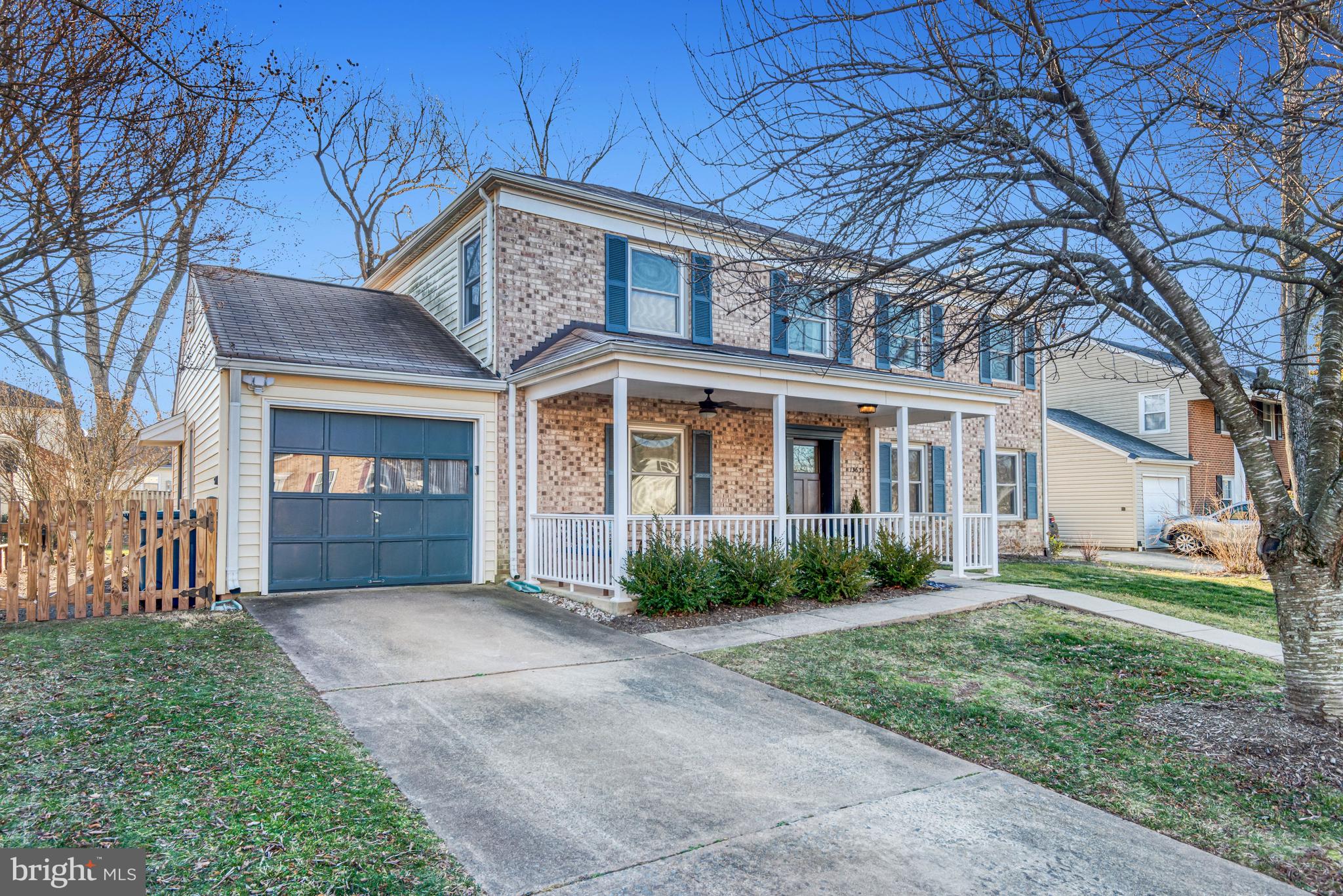 13631 Ellendale Drive Chantilly, VA 20151 - Photo 2 of 54 a front view of a house with a yard and trees