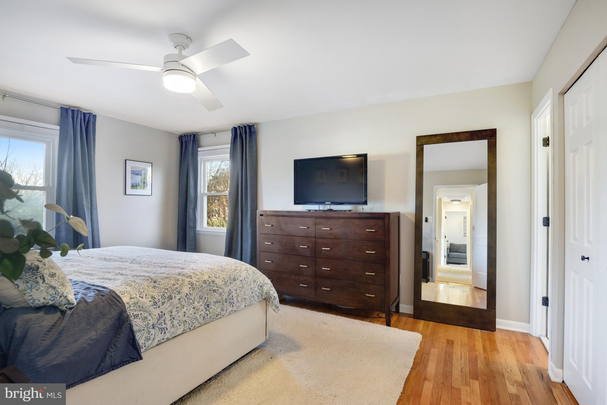 13631 Ellendale Drive Chantilly, VA 20151 - Photo 32 of 54 a bedroom with a bed and a dresser