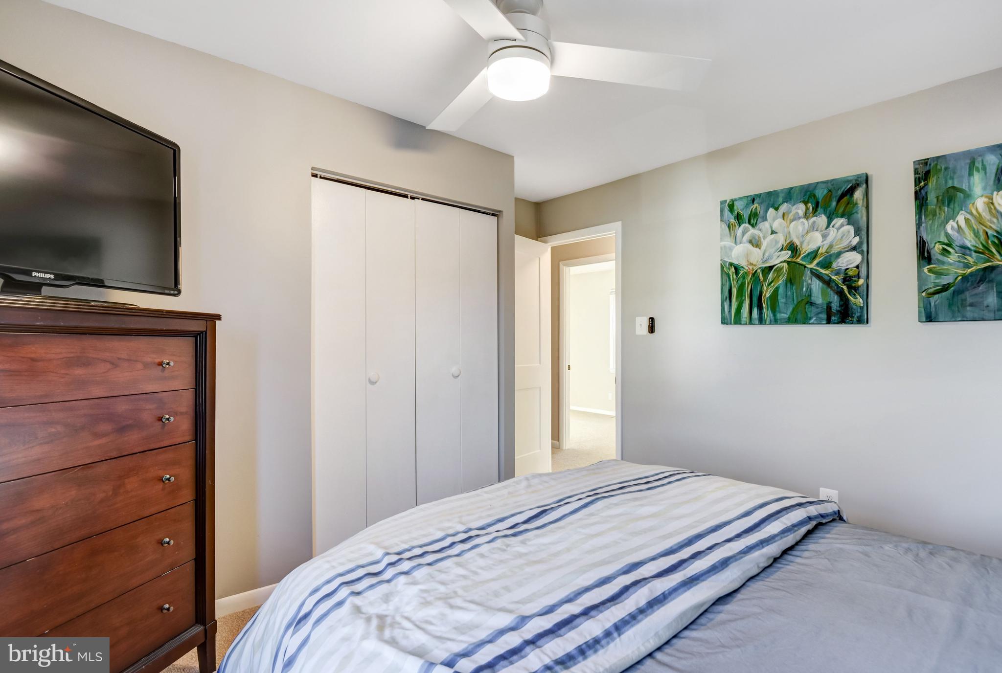 13631 Ellendale Drive Chantilly, VA 20151 - Photo 37 of 54 a bedroom with a bed and a flat screen tv