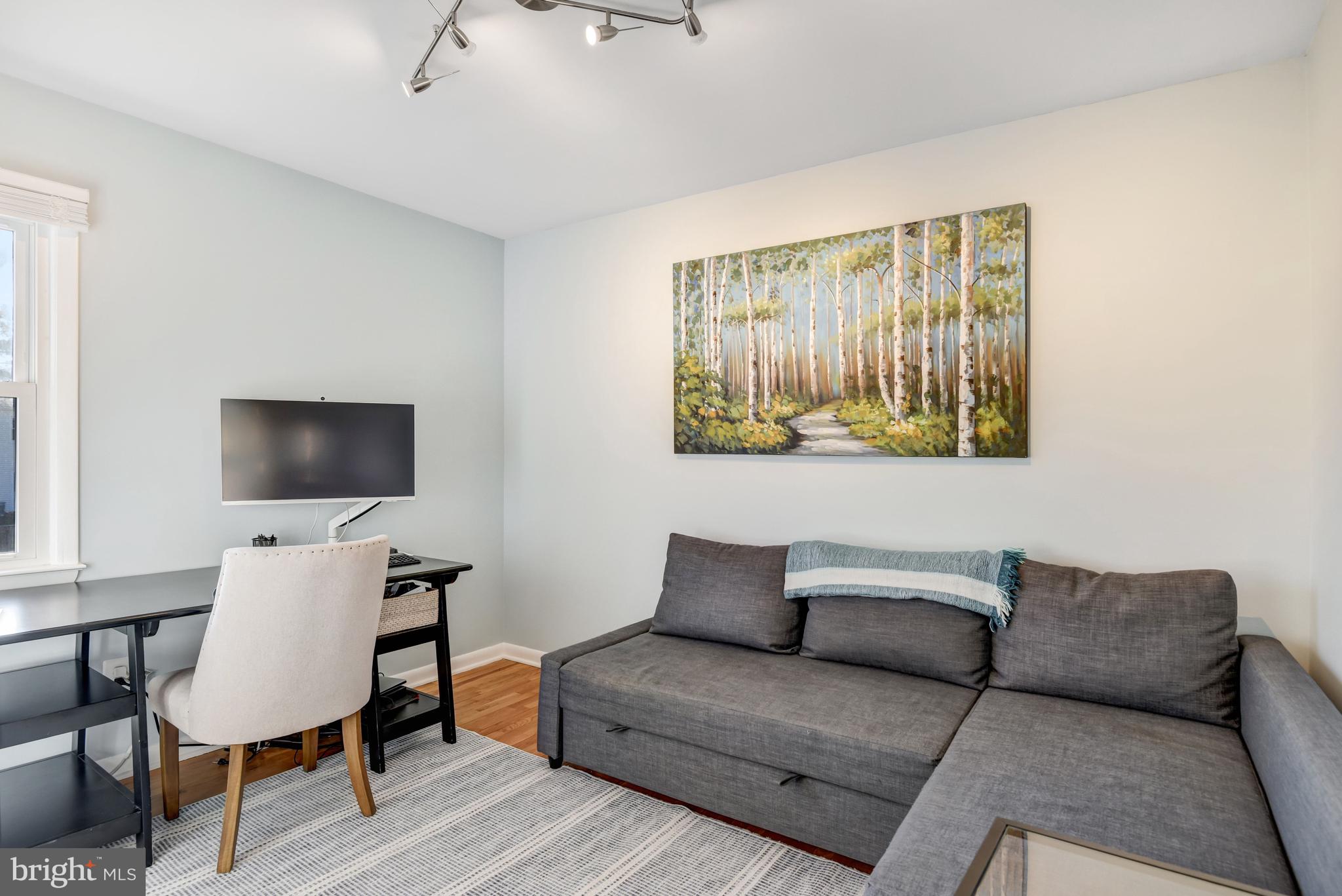 13631 Ellendale Drive Chantilly, VA 20151 - Photo 38 of 54 a living room with furniture and a flat screen tv