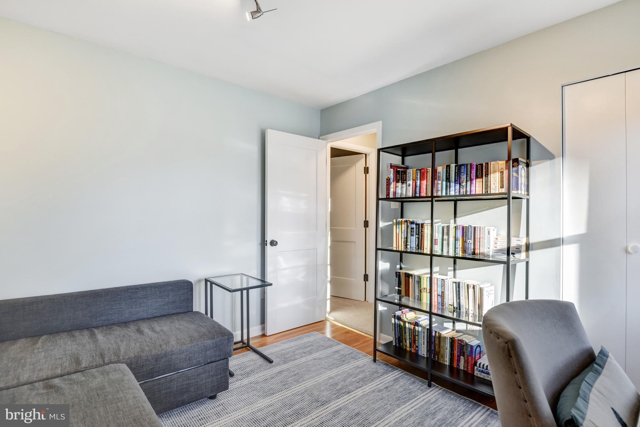 13631 Ellendale Drive Chantilly, VA 20151 - Photo 39 of 54 a living room with furniture and a book shelf