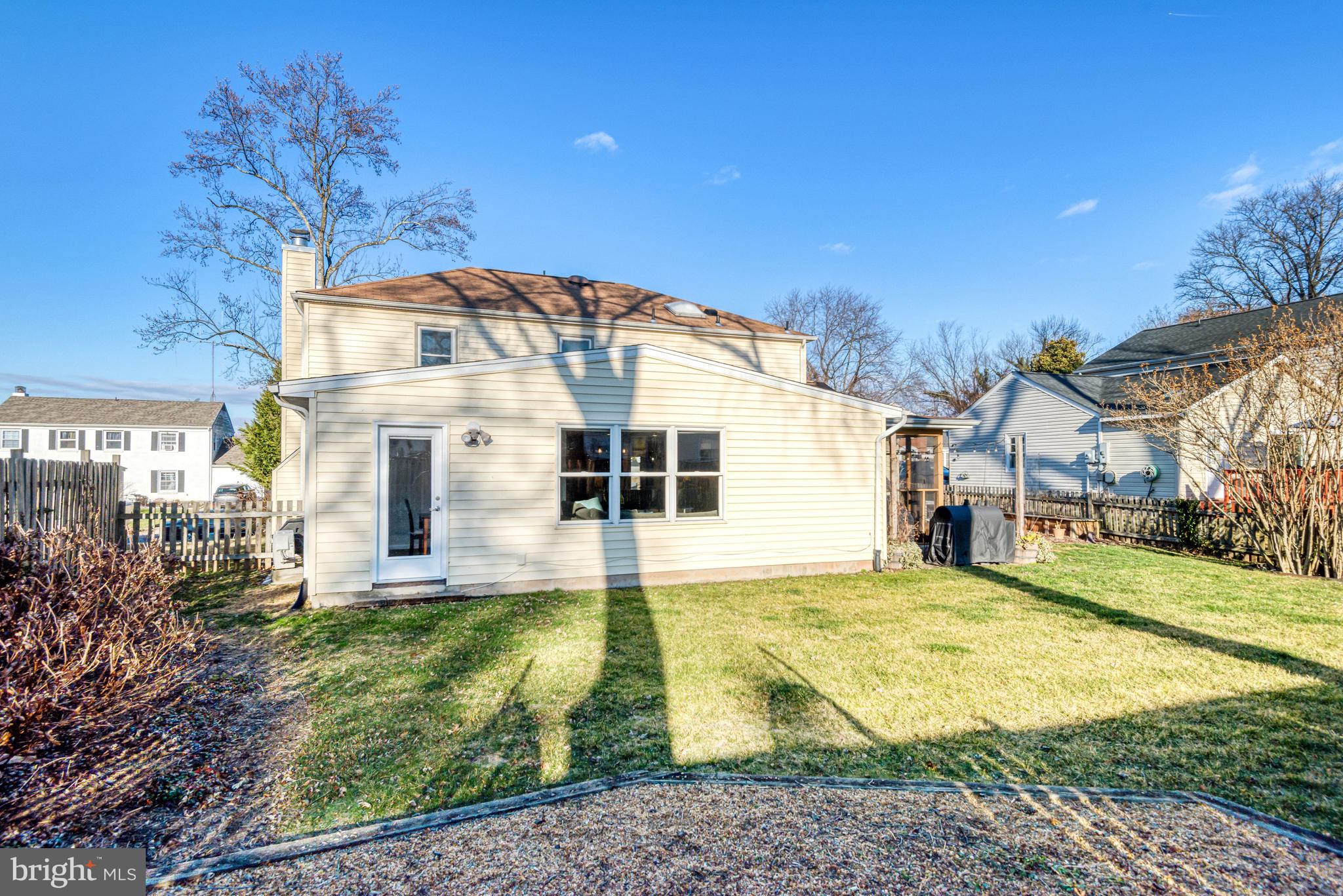 13631 Ellendale Drive Chantilly, VA 20151 - Photo 51 of 54 a view of a white house with a big yard and large trees