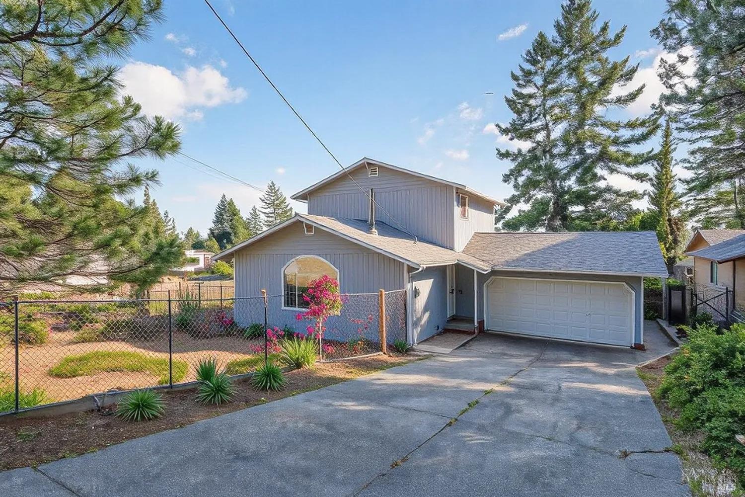 27841 Poppy Drive Willits, CA 95490 - Photo 1 of 17 a front view of a house with a yard and garage