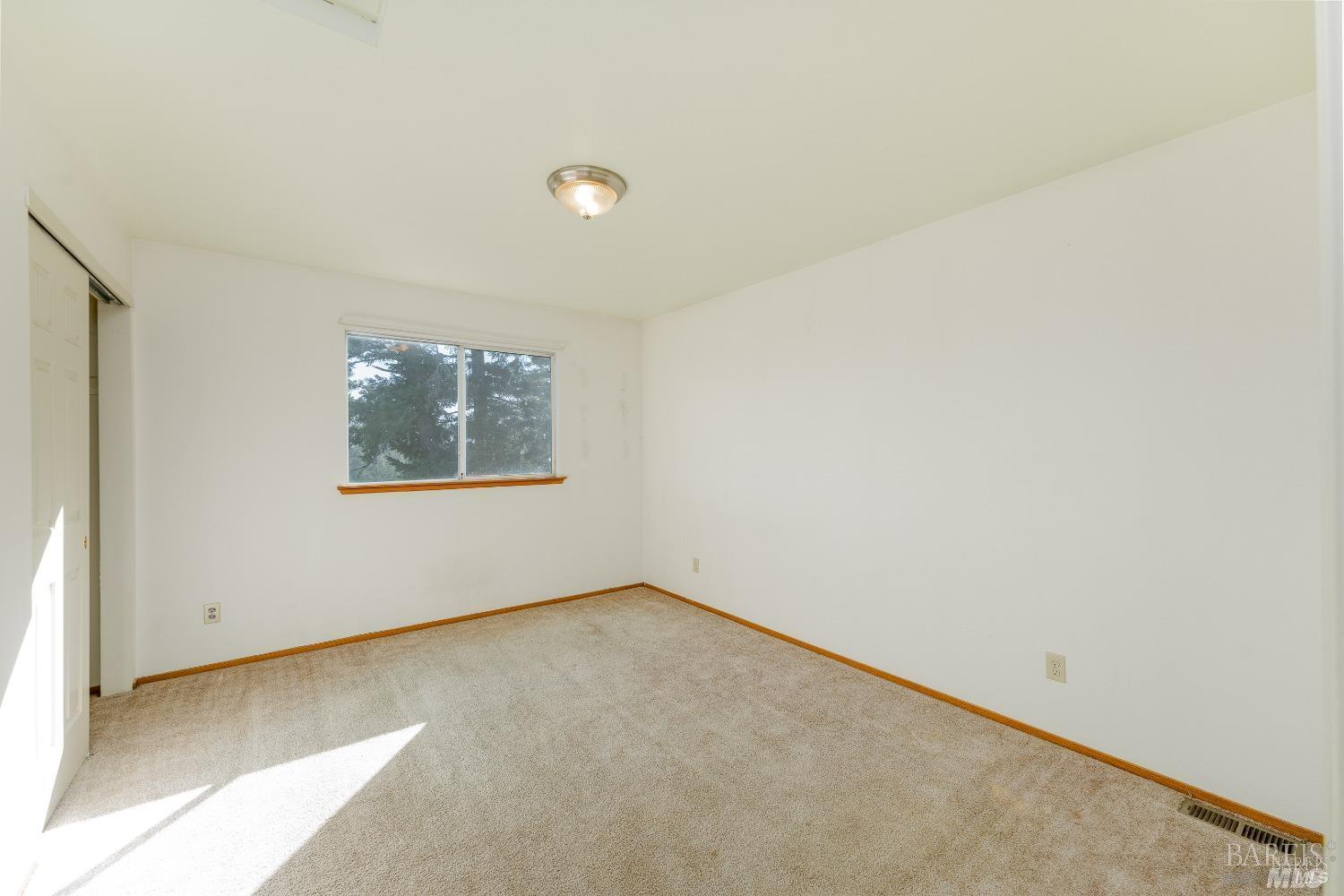 27841 Poppy Drive Willits, CA 95490 - Photo 11 of 17 an empty room with a window