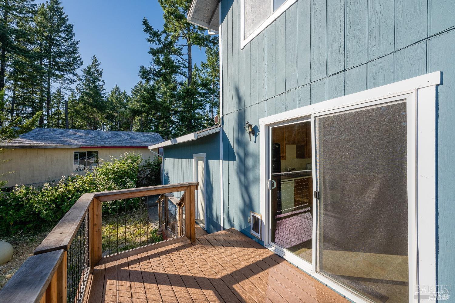 27841 Poppy Drive Willits, CA 95490 - Photo 15 of 17 a view of backyard with small cabin and wooden fencing