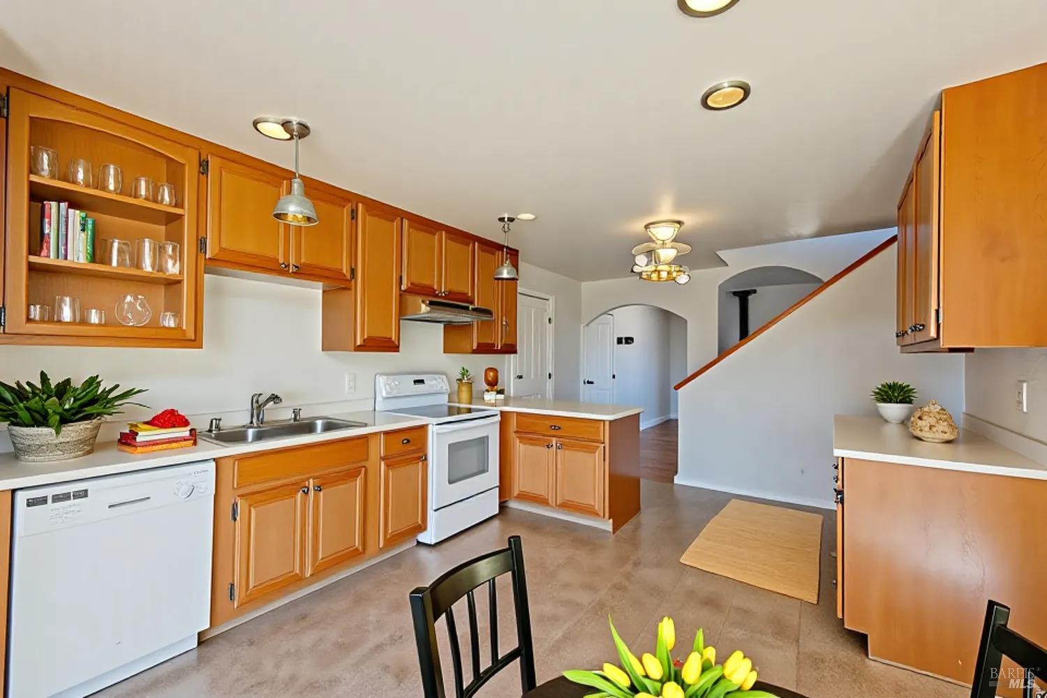 27841 Poppy Drive Willits, CA 95490 - Photo 3 of 17 a kitchen with stainless steel appliances kitchen island granite countertop a sink stove and cabinets