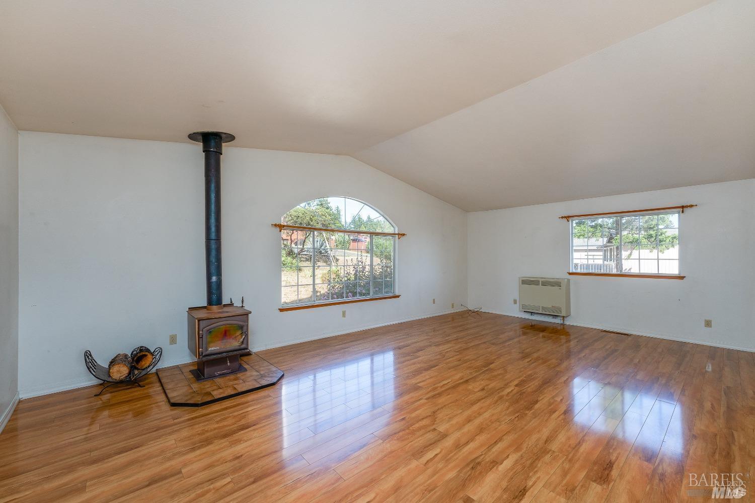 27841 Poppy Drive Willits, CA 95490 - Photo 5 of 17 wooden floor in an empty room with a window