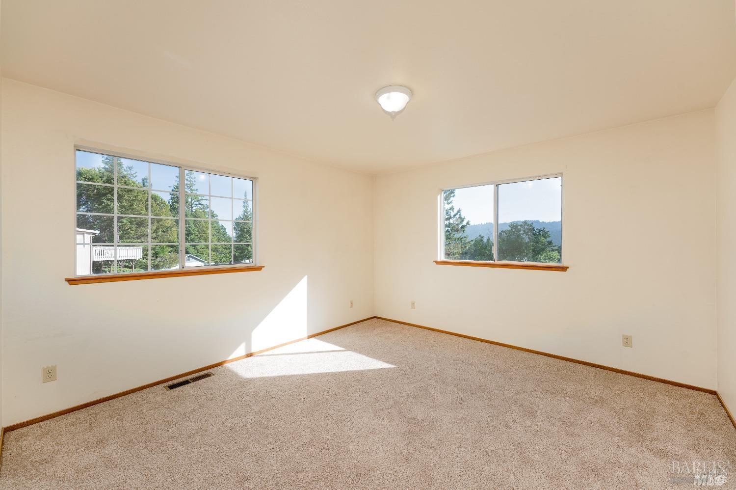 27841 Poppy Drive Willits, CA 95490 - Photo 8 of 17 an empty room with windows