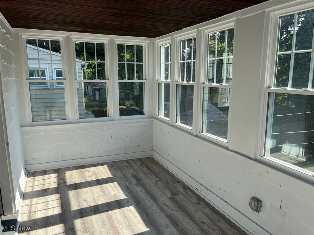 1148 Sylvania Road Cleveland Heights, OH 44121 - Photo 19 of 30 Unfurnished sunroom featuring lvt floors.