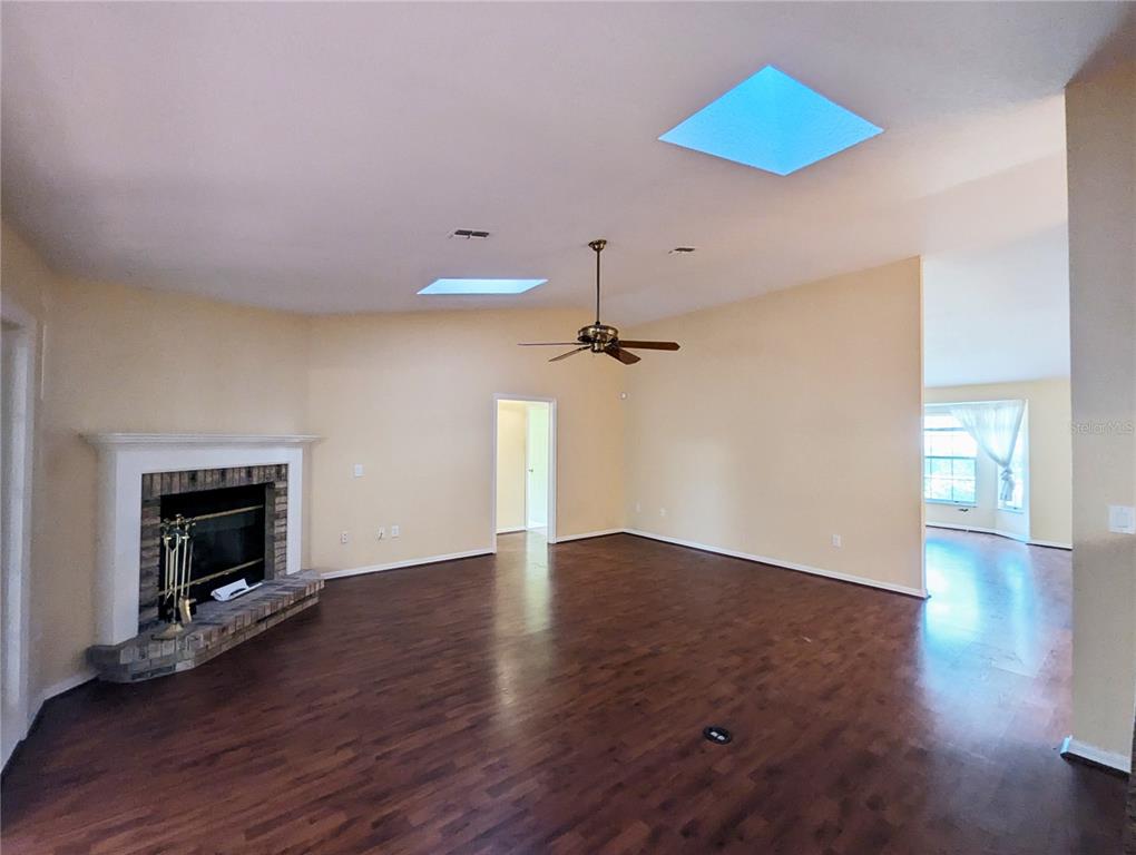 3 Graytwig Court West Homosassa, FL 34446 - Photo 11 of 41 a view of empty room with wooden floor and fan