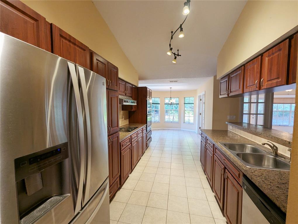 3 Graytwig Court West Homosassa, FL 34446 - Photo 13 of 41 a kitchen with stainless steel appliances granite countertop a refrigerator a stove and a sink