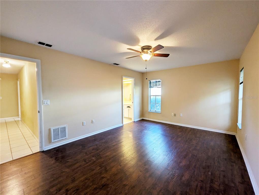 3 Graytwig Court West Homosassa, FL 34446 - Photo 19 of 41 an empty room with wooden floor and window