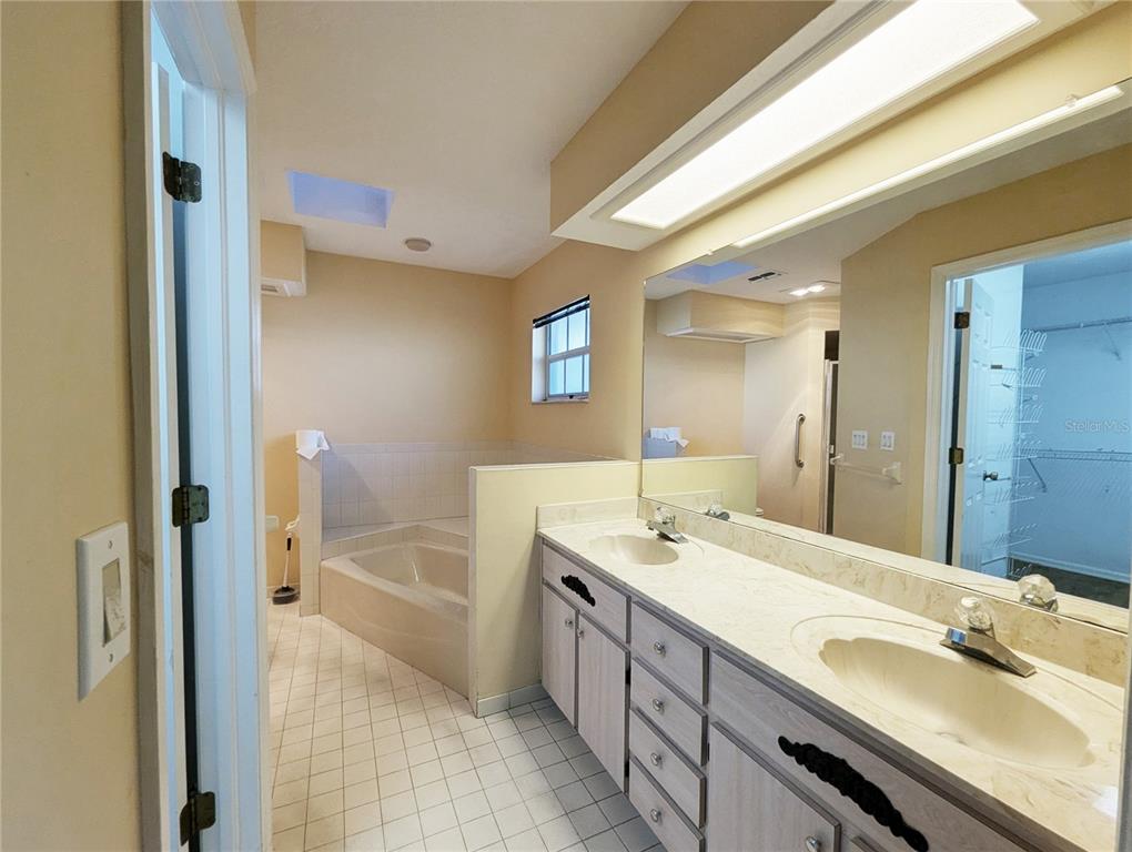 3 Graytwig Court West Homosassa, FL 34446 - Photo 20 of 41 a bathroom with a tub sink and mirror
