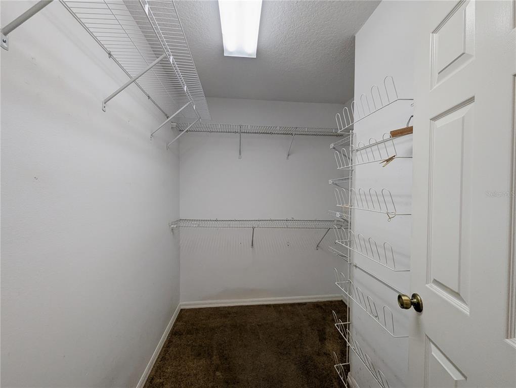 3 Graytwig Court West Homosassa, FL 34446 - Photo 21 of 41 a view of storage and utility room with racks on the wall