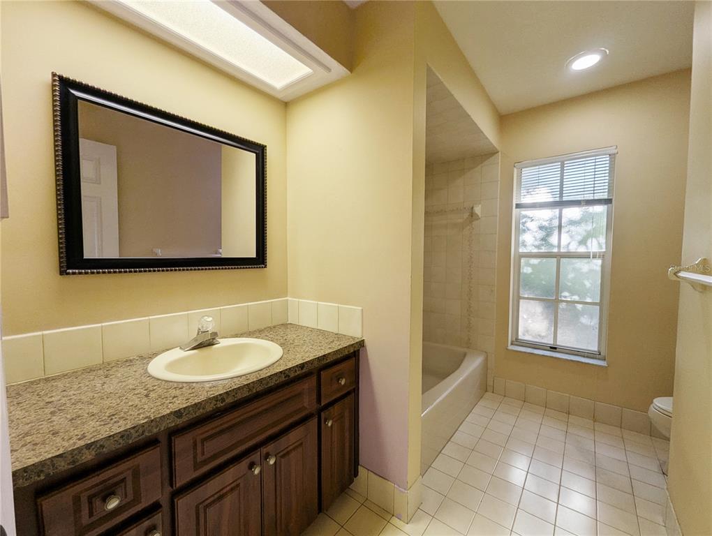3 Graytwig Court West Homosassa, FL 34446 - Photo 25 of 41 a bathroom with a granite countertop sink a mirror and a