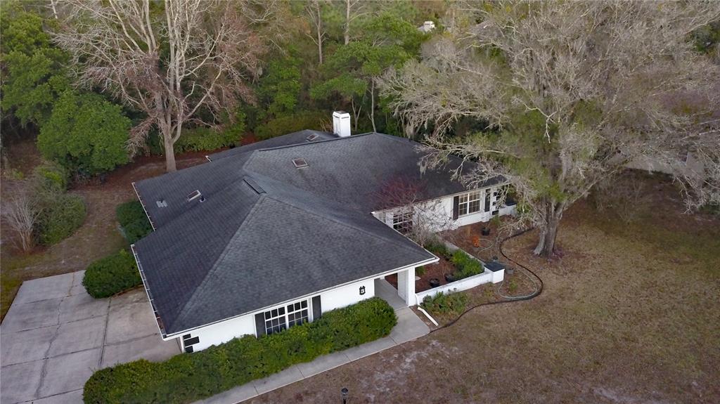 3 Graytwig Court West Homosassa, FL 34446 - Photo 37 of 41 an aerial view of a house with a yard and trees