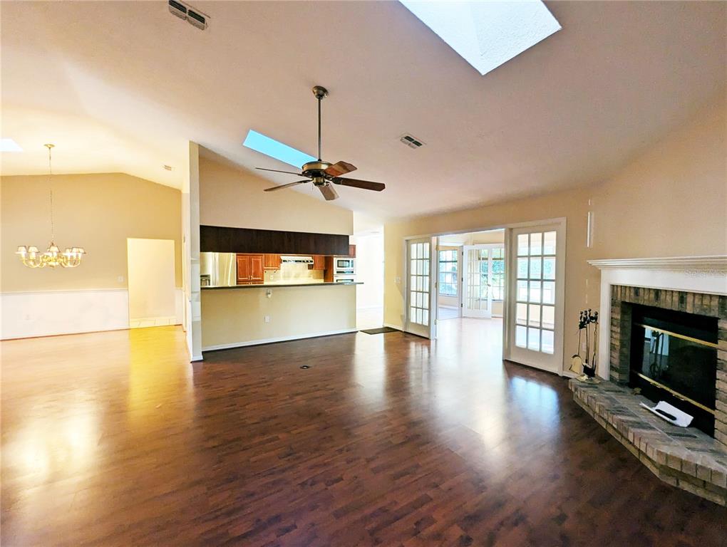 3 Graytwig Court West Homosassa, FL 34446 - Photo 4 of 41 a view of an empty room with a fireplace and wooden floor