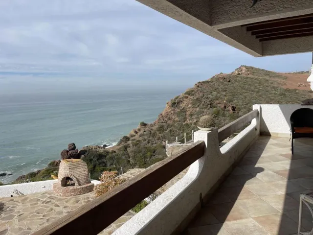 a bedroom with a bed and a flat tv screen next to a window