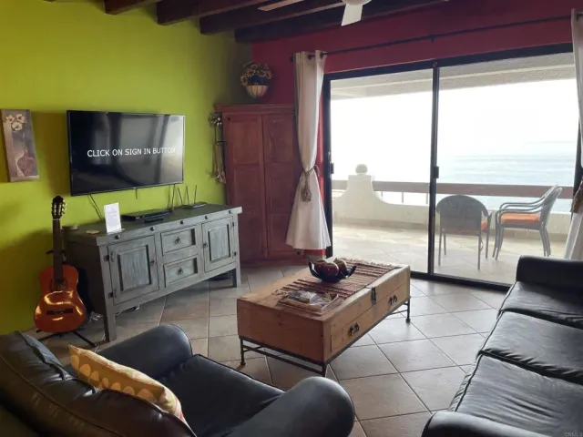 a view of a dinning table and chairs in the patio