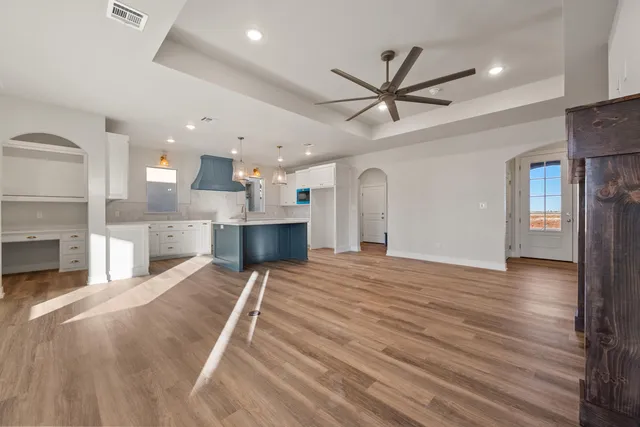 a view of a kitchen with a sink and a fireplace