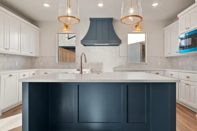 a kitchen with a sink and a refrigerator