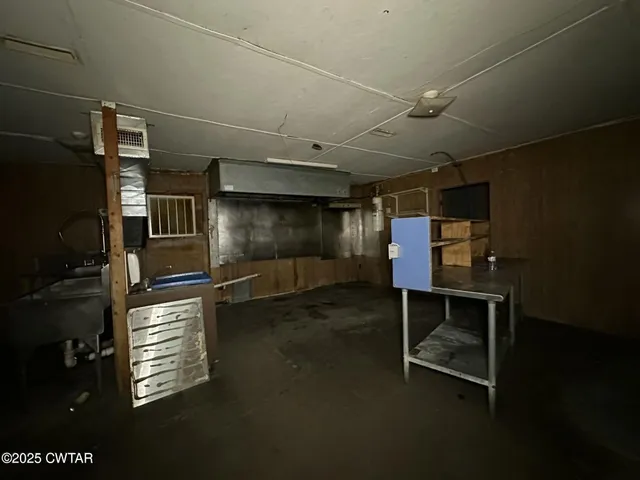 a room with wooden cabinets and outdoor seating