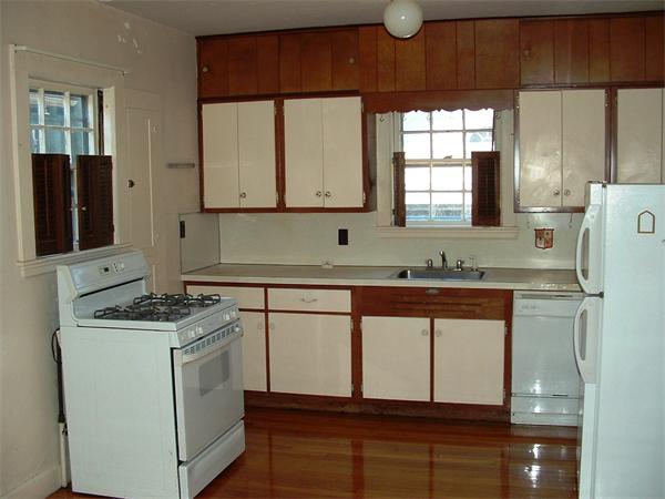 5 Thompson Road Marblehead, MA 01945 - Photo 6 of 8 a kitchen with stainless steel appliances granite countertop a stove a sink and a microwave