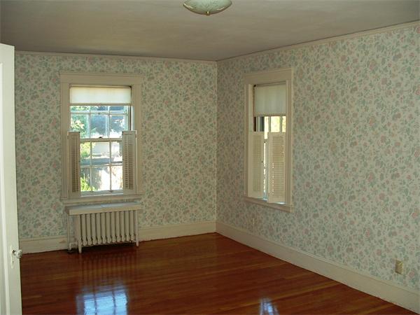 5 Thompson Road Marblehead, MA 01945 - Photo 7 of 8 an empty room with wooden floor and windows