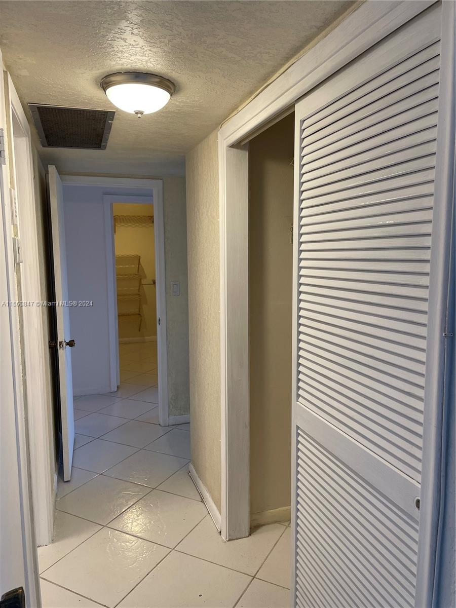 Inverrary Lauderhill, FL 33319 - Photo 6 of 18 a view of a hallway with a bathroom