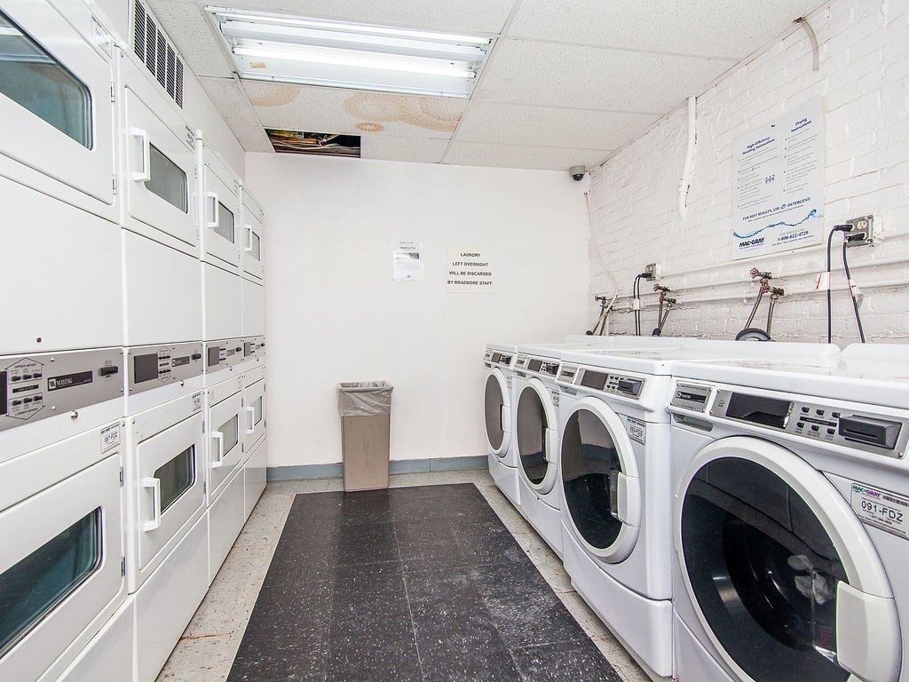 464 Commonwealth Avenue, Unit 36 Boston, MA 02215 - Photo 7 of 18 a utility room with dryer and washer