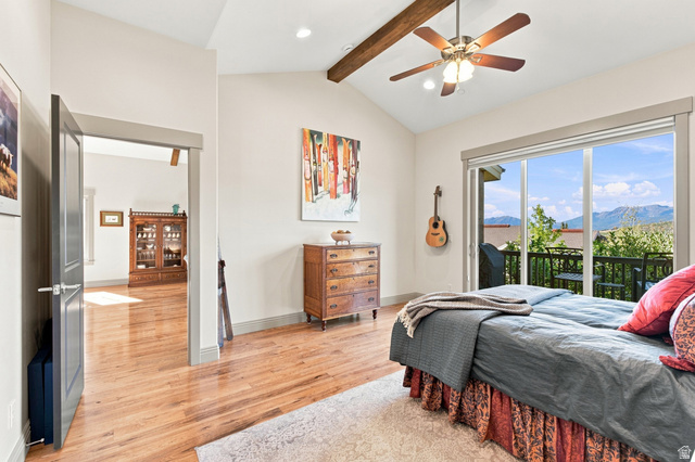 5207 North Oldgate Road Heber City, UT 84032 - Photo 20 of 58 Vaulted ceiling with exposed wood beam, wood-finish flooring, sliding glass door to exterior balcony, recessed lighting, and ceiling fan