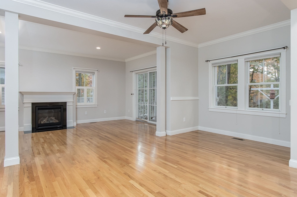 21 A Blacksmith Row, Unit 21 Groton, MA 01450 - Photo 11 of 42 a view of an empty room with a window and fireplace
