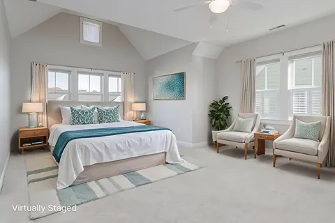 a bedroom with a bed and a couch