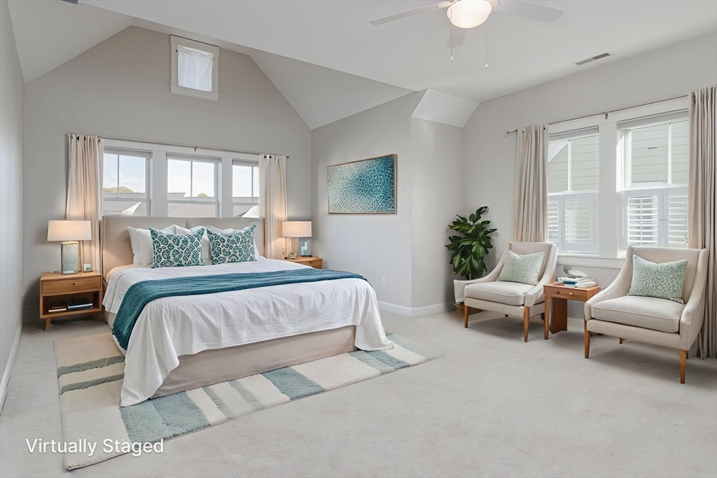 21 A Blacksmith Row, Unit 21 Groton, MA 01450 - Photo 23 of 42 a bedroom with a bed and a couch