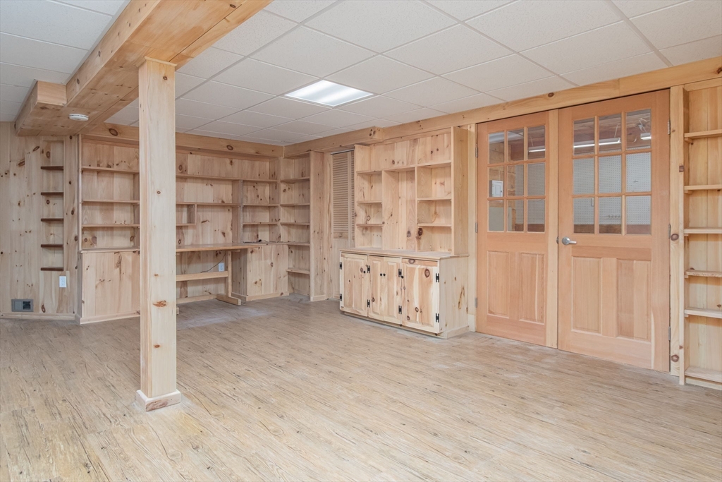 21 A Blacksmith Row, Unit 21 Groton, MA 01450 - Photo 31 of 42 an empty room with shelves