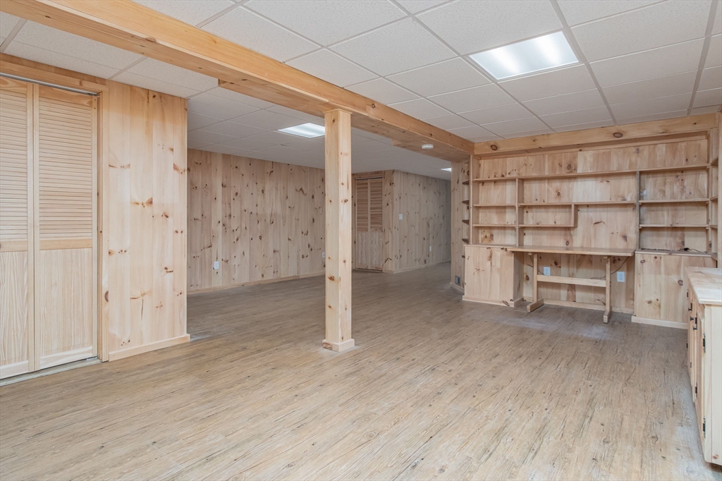 21 A Blacksmith Row, Unit 21 Groton, MA 01450 - Photo 32 of 42 a view of a room with racks on the wall