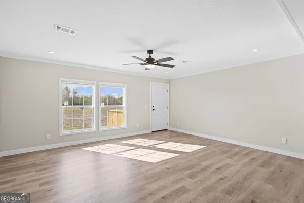 a kitchen with a sink cabinets and window