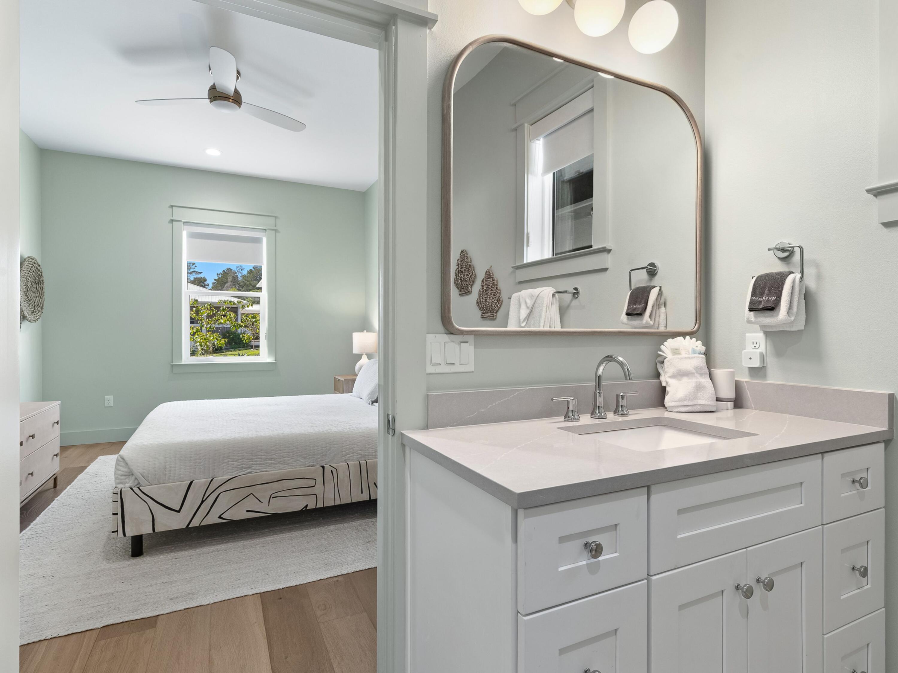 183 Walnut Street Santa Rosa Beach, FL 32459 - Photo 19 of 71 a en suite bathroom with a double vanity sink and a mirror