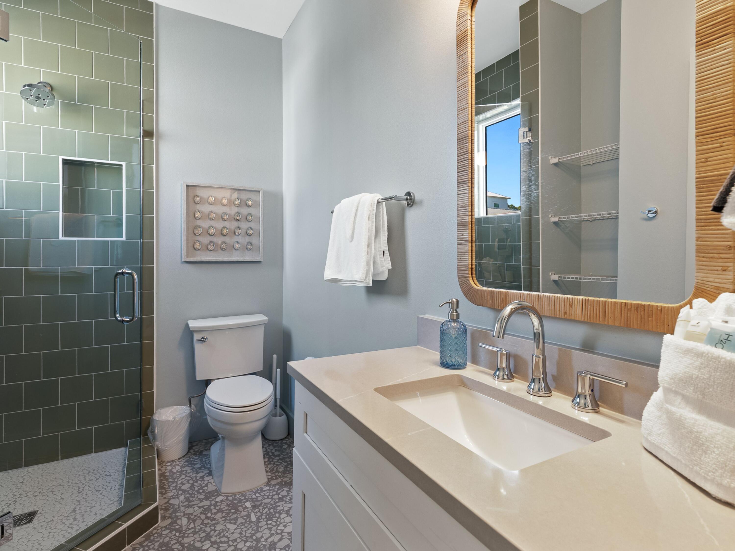 183 Walnut Street Santa Rosa Beach, FL 32459 - Photo 22 of 71 a bathroom with a sink a toilet and mirror