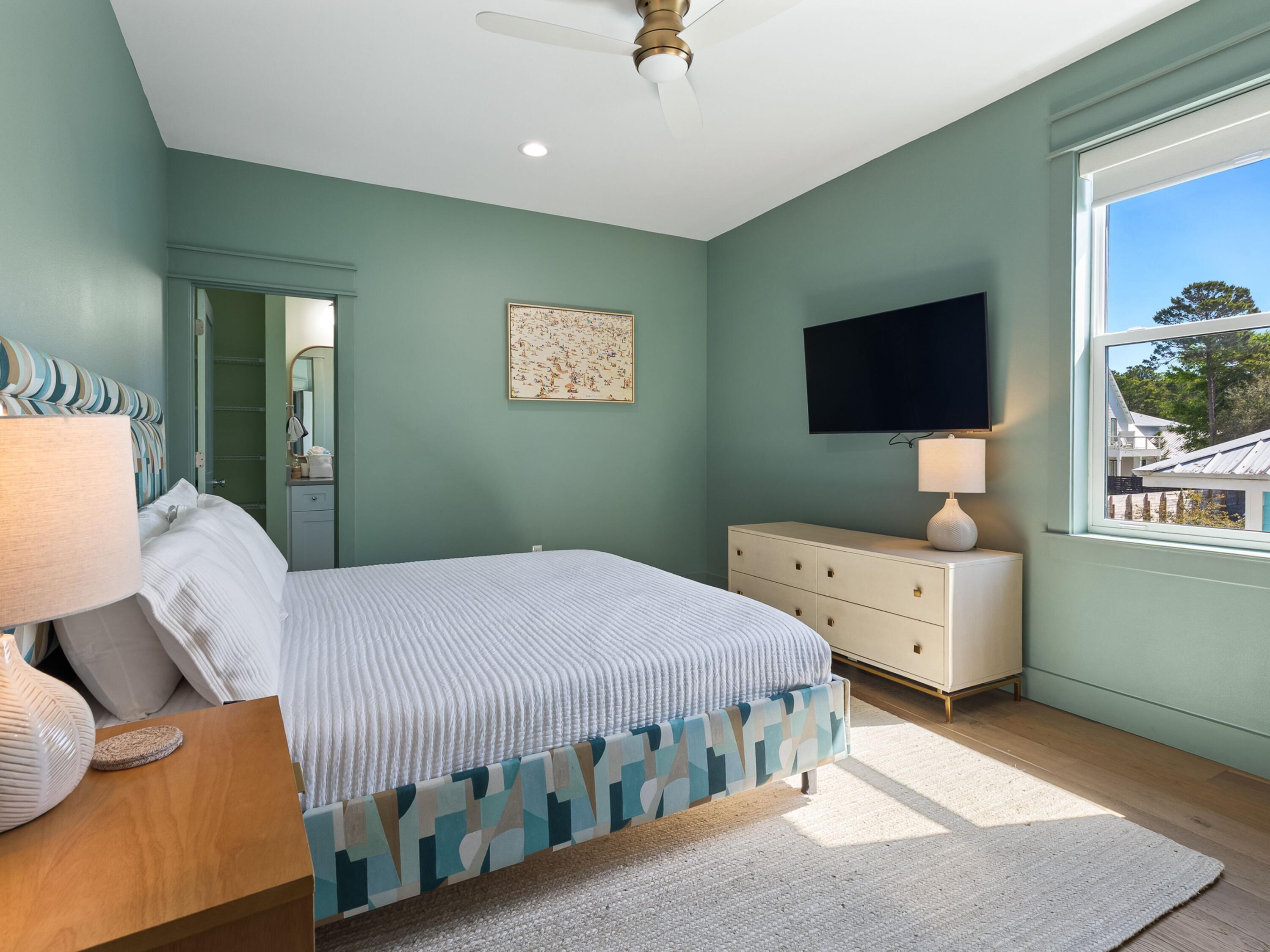 183 Walnut Street Santa Rosa Beach, FL 32459 - Photo 23 of 71 a bedroom with a bed and a flat screen tv