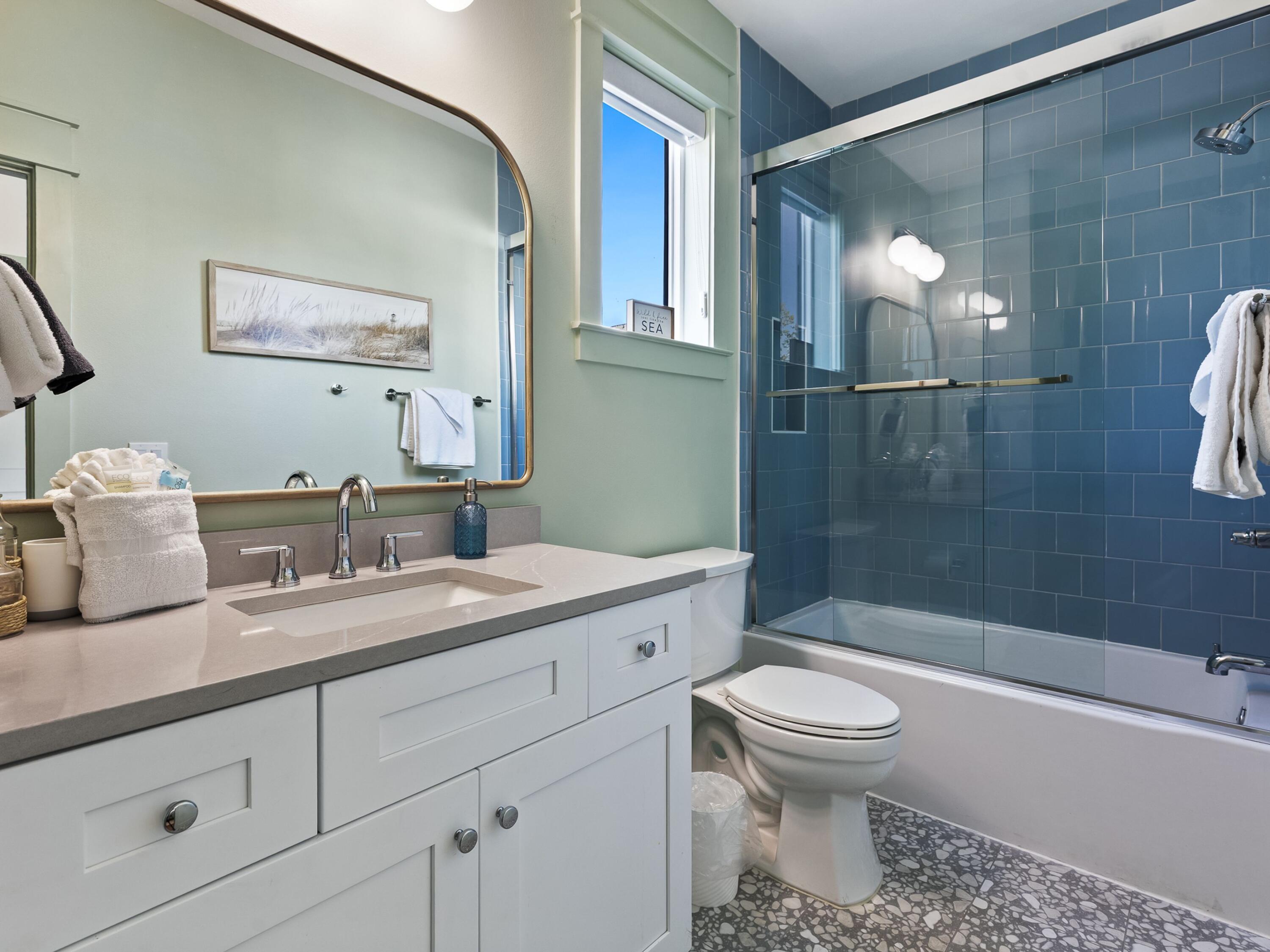 183 Walnut Street Santa Rosa Beach, FL 32459 - Photo 24 of 71 a bathroom with a granite countertop sink a toilet a mirror and shower