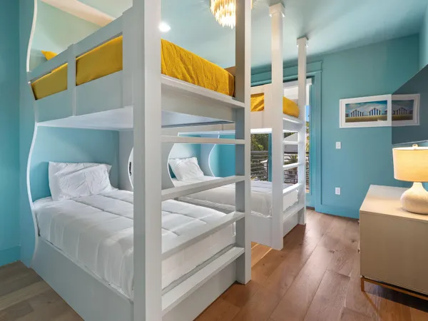 a bedroom with a large bed and a large window